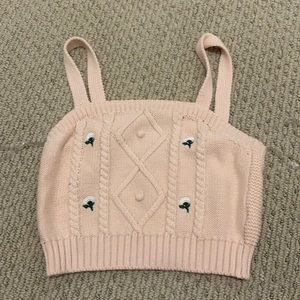 Sleeveless pink knit top
